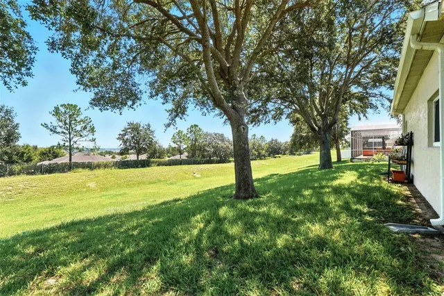 a view of building with trees in front of it
