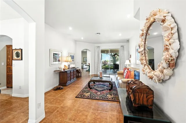 a living room with furniture fireplace and a table