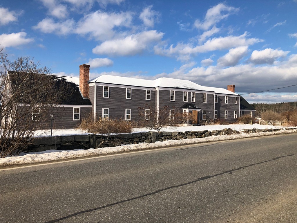 83 Wilder Road Bolton, MA 01740 - Photo 1 of 27 a view of a house next to a yard