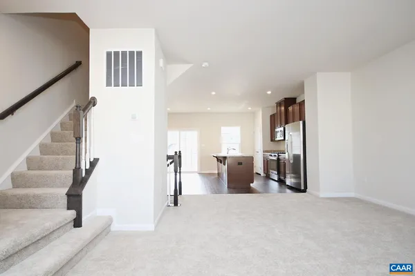 a view of livingroom with furniture and workspace
