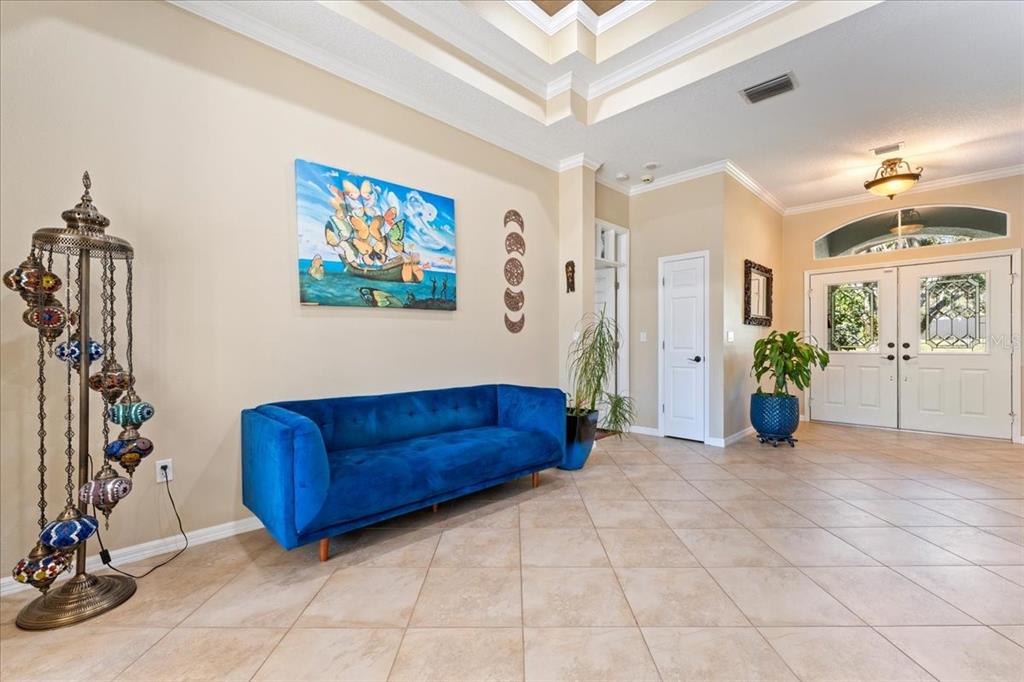 13624 Cooper Road Spring Hill, FL 34609 - Photo 18 of 75 a view of a livingroom with furniture and a chandelier fan