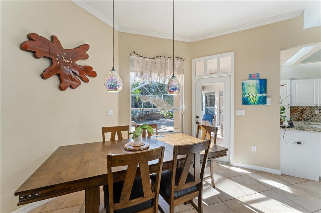 13624 Cooper Road Spring Hill, FL 34609 - Photo 25 of 75 a view of a dining room with furniture window and wooden floor
