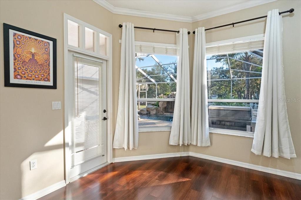13624 Cooper Road Spring Hill, FL 34609 - Photo 33 of 75 a view of a room with wooden floor and front door