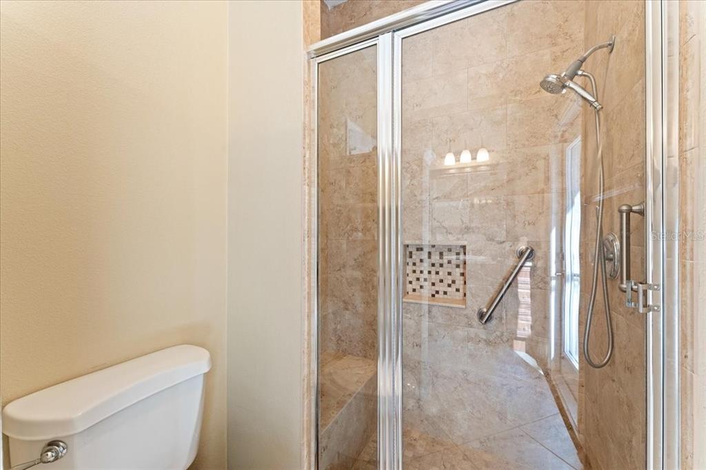 13624 Cooper Road Spring Hill, FL 34609 - Photo 36 of 75 a bathroom with a shower and toilet