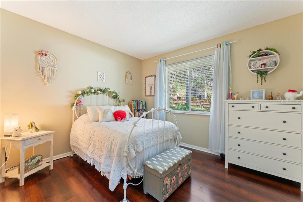 13624 Cooper Road Spring Hill, FL 34609 - Photo 37 of 75 a bedroom with a bed and a dresser