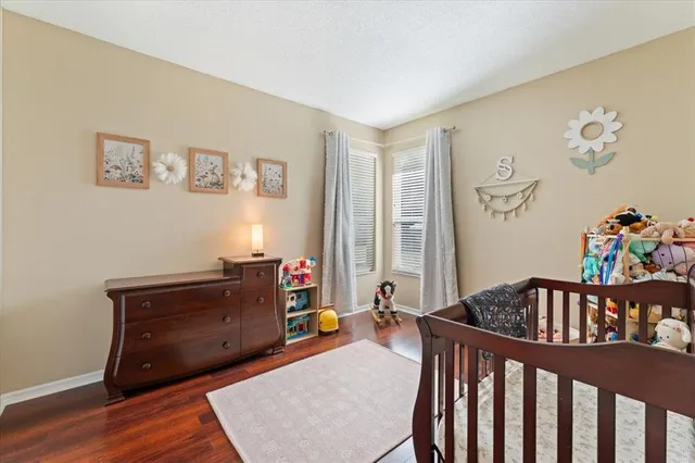 a front view of house with yard and swimming pool