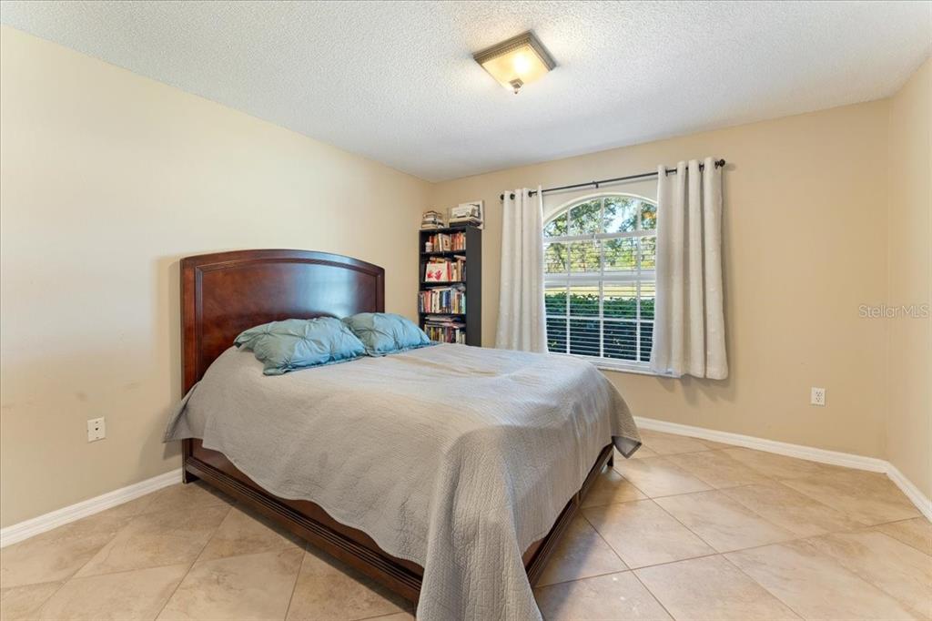 13624 Cooper Road Spring Hill, FL 34609 - Photo 45 of 75 a bedroom with a bed and window
