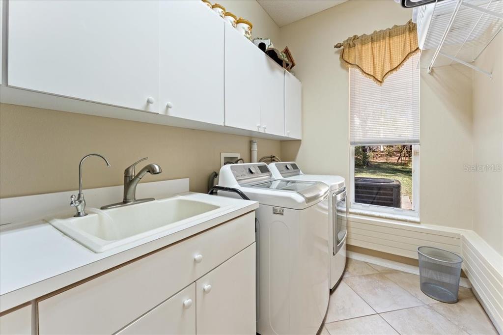13624 Cooper Road Spring Hill, FL 34609 - Photo 47 of 75 a utility room with dryer and washer