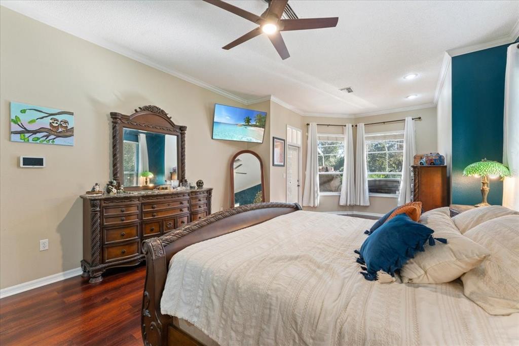 13624 Cooper Road Spring Hill, FL 34609 - Photo 7 of 75 a bedroom with a bed and a large window