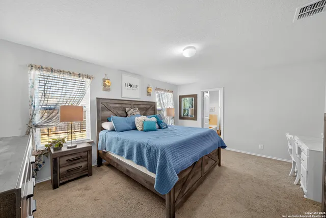 a bedroom with a bed and a cabinets