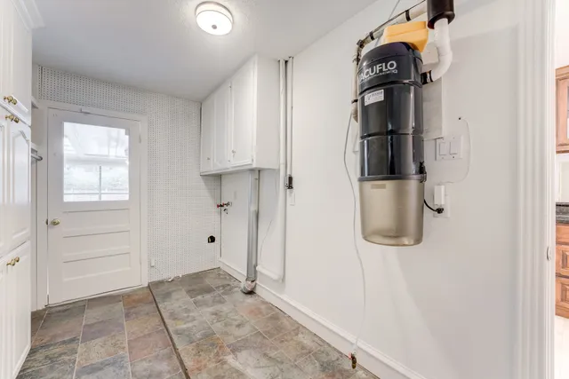 a view of a storage & utility room with a sink