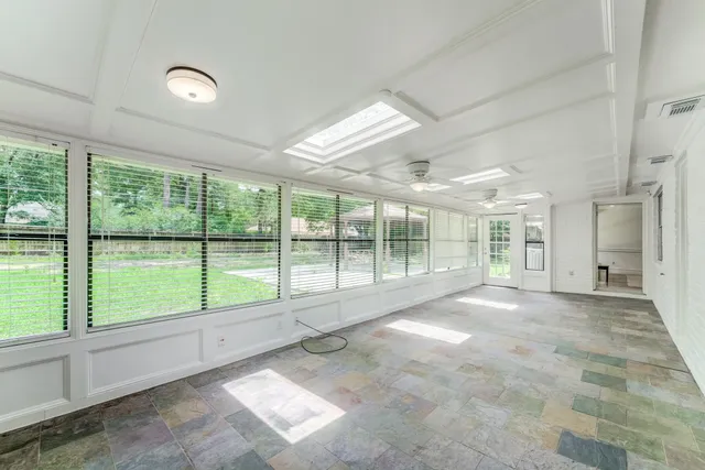 a view of an empty room with a large window