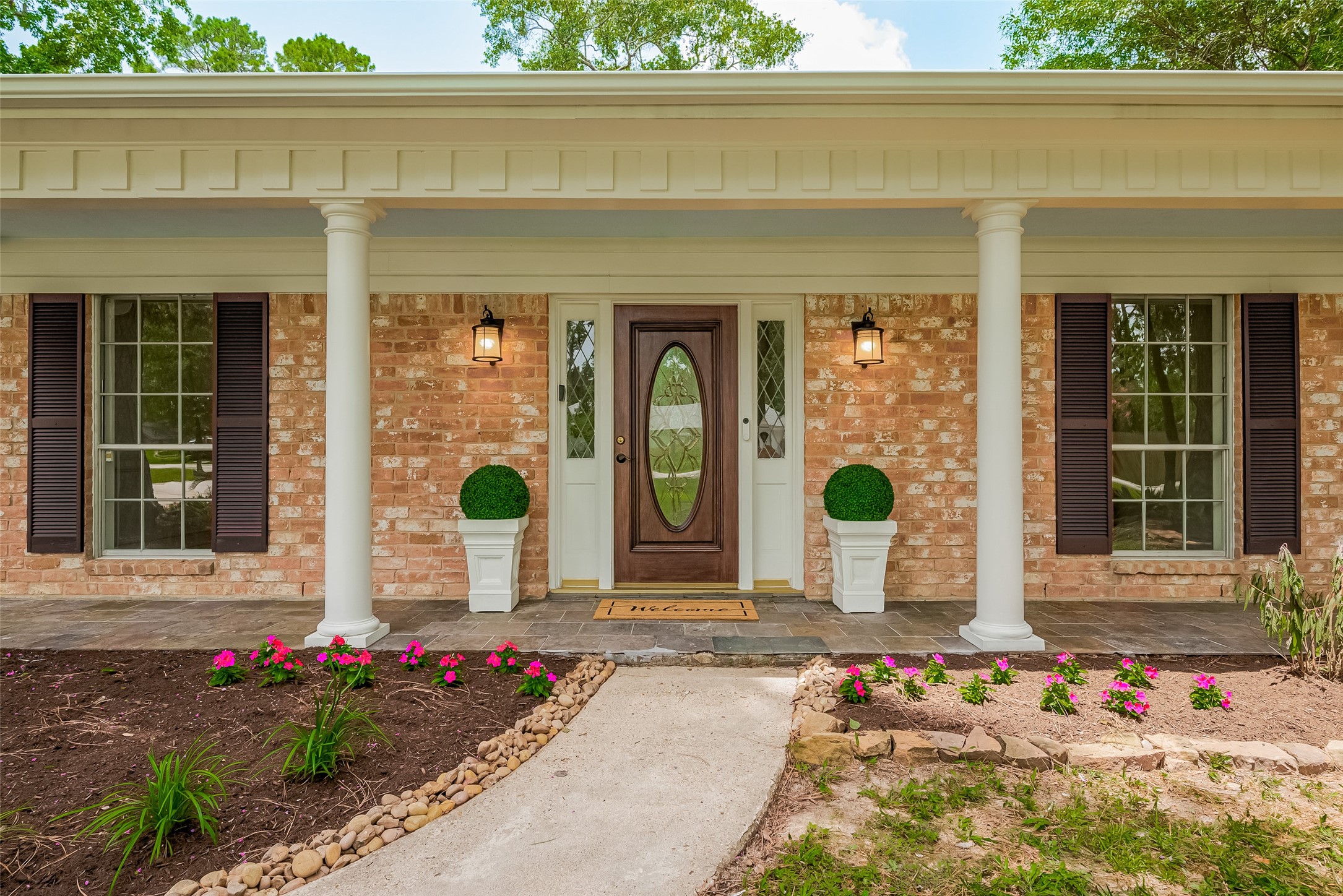 323 Spring Woods Drive Spring, TX 77386 - Photo 4 of 50 a front view of a house with outdoor space