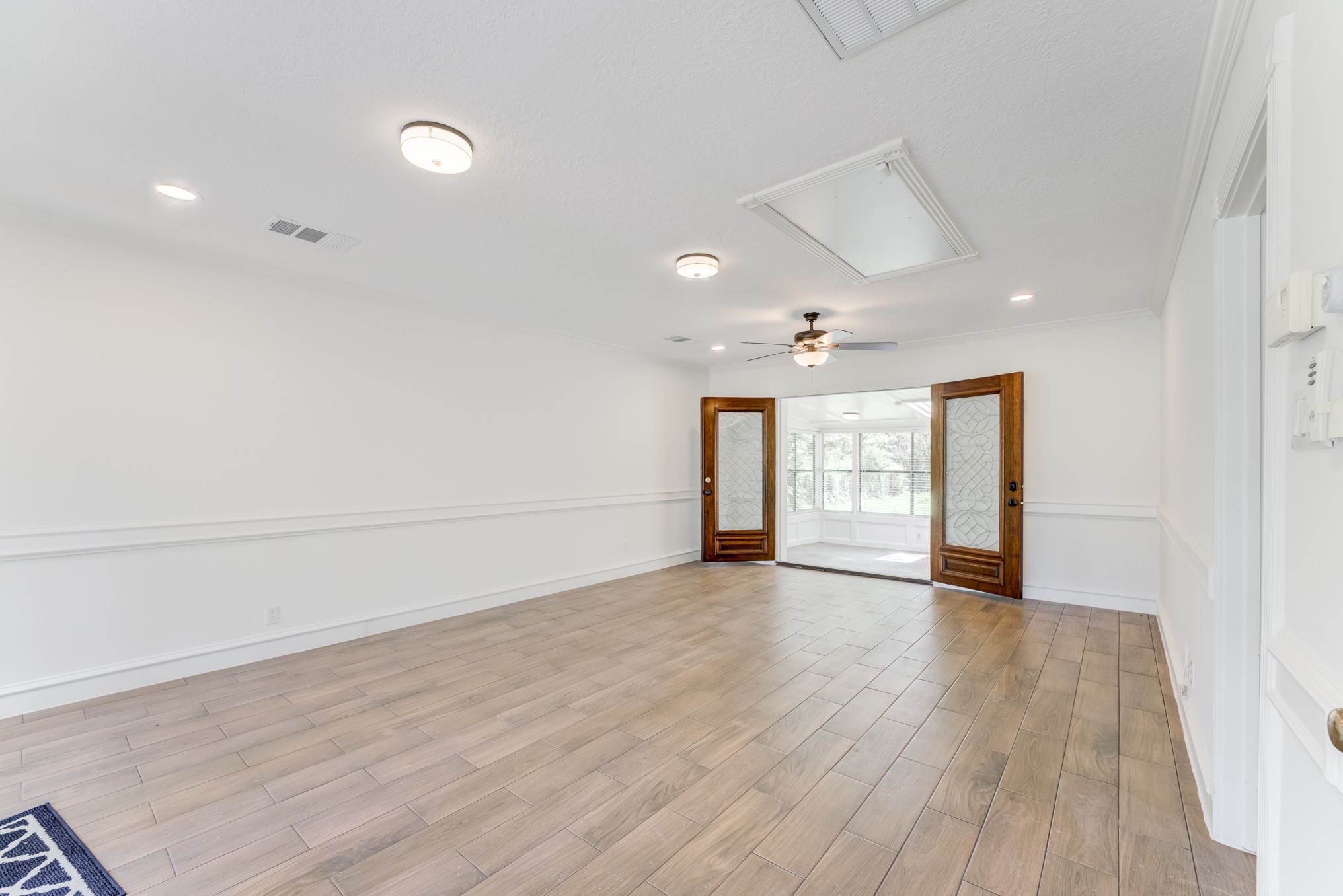 323 Spring Woods Drive Spring, TX 77386 - Photo 46 of 50 an empty room with wooden floor and windows