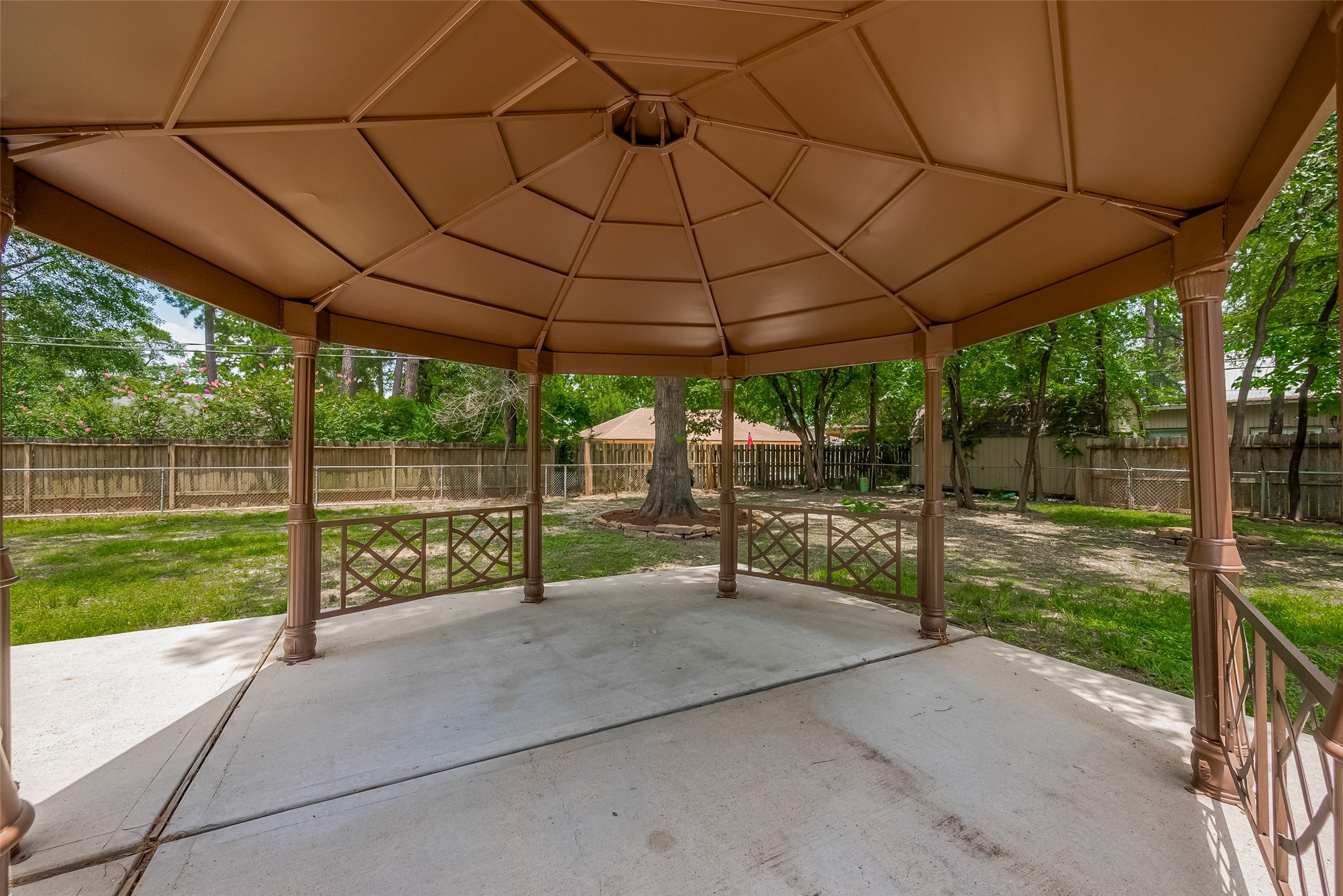 323 Spring Woods Drive Spring, TX 77386 - Photo 50 of 50 a view of a backyard with plants and garden