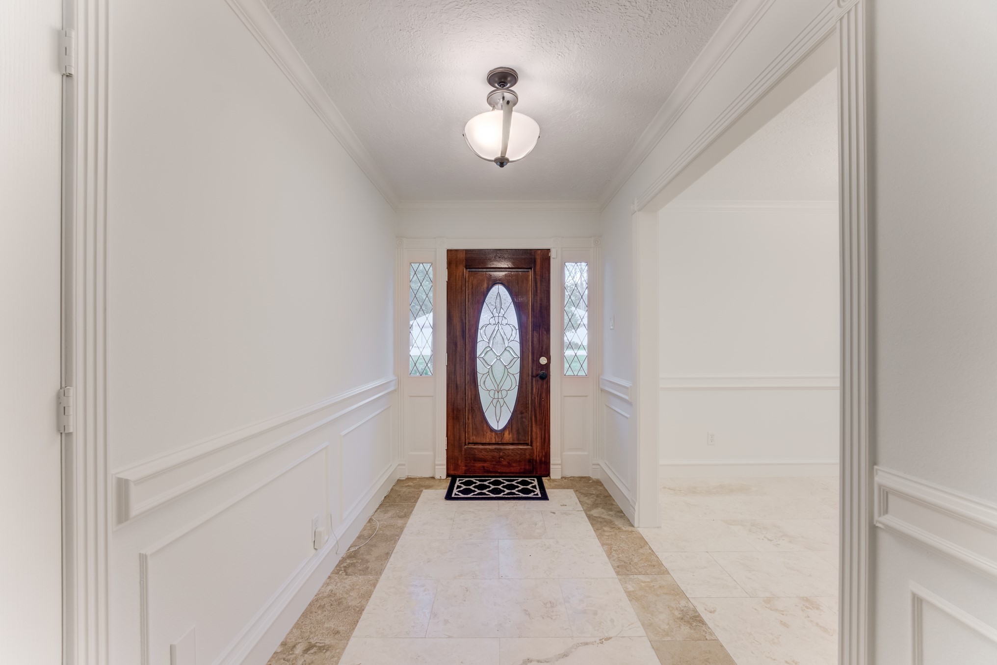 323 Spring Woods Drive Spring, TX 77386 - Photo 5 of 50 a view of a hallway with a dining room