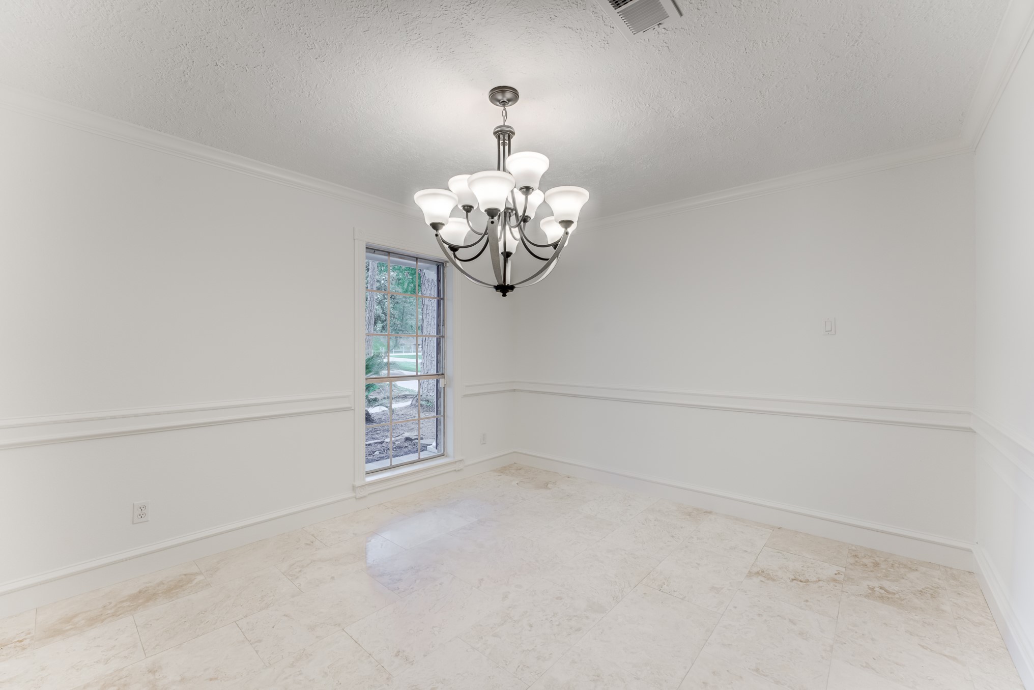 323 Spring Woods Drive Spring, TX 77386 - Photo 10 of 50 a close view of a chandelier in big room