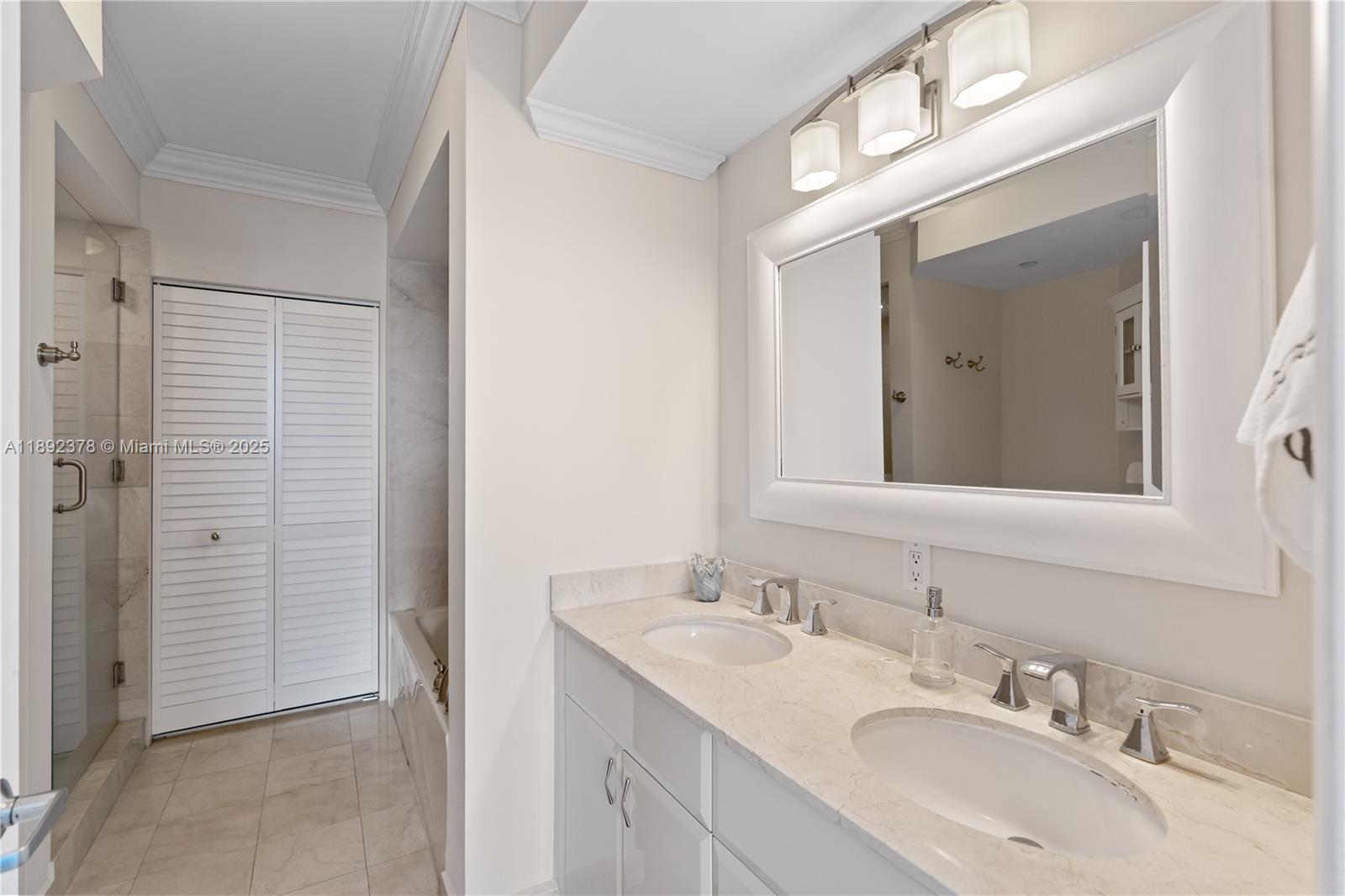 6365 Collins Avenue, Unit 3611 Miami Beach, FL 33141 - Photo 14 of 20 a bathroom with a sink and a mirror