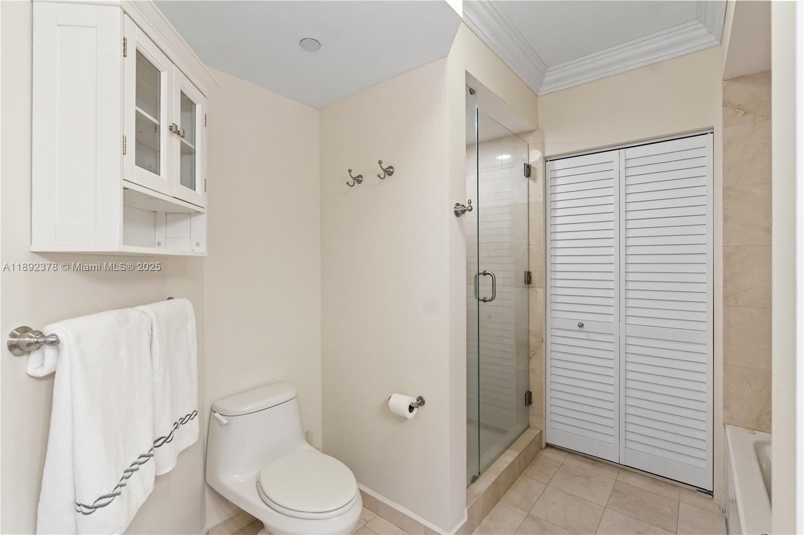 6365 Collins Avenue, Unit 3611 Miami Beach, FL 33141 - Photo 15 of 20 a white toilet sitting next to a bathroom sink