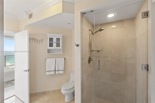 a bathroom with a shower toilet and sink