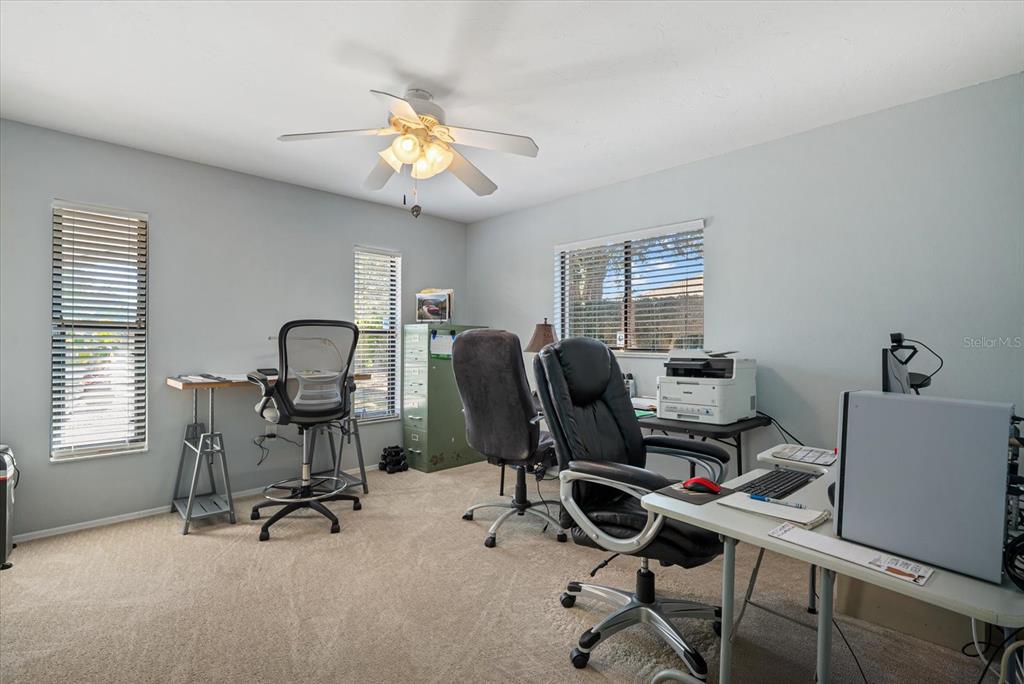 4132 Prairie View Drive Sarasota, FL 34232 - Photo 13 of 24 a view of a workspace with furniture and a window