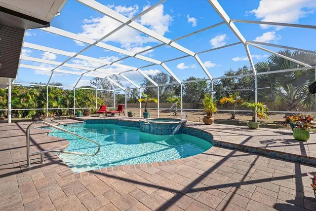 a view of a swimming pool with a patio
