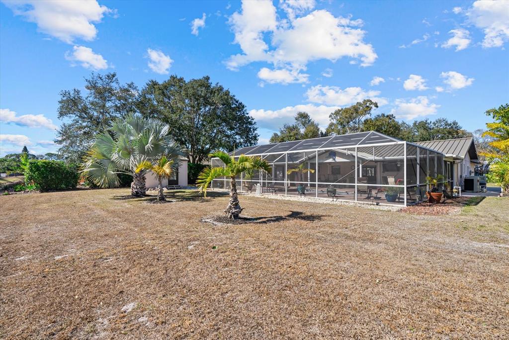 4132 Prairie View Drive Sarasota, FL 34232 - Photo 18 of 24 a view of a house with backyard and sitting area