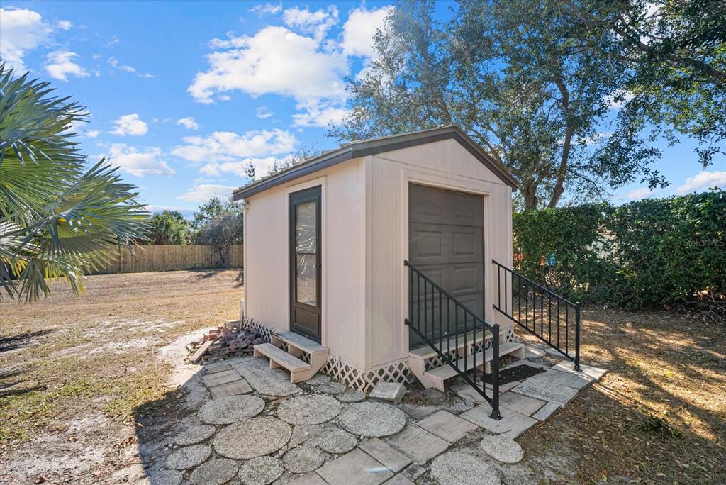 4132 Prairie View Drive Sarasota, FL 34232 - Photo 21 of 24 a view of a house with a yard