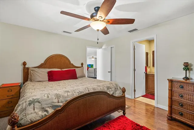 a bedroom with a bed and a dresser