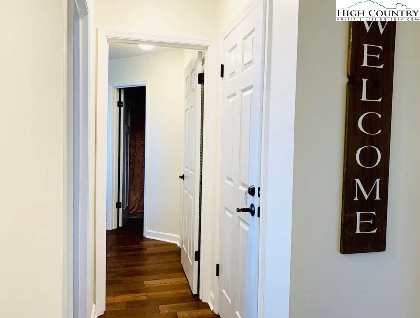 301 Pinnacle Inn Road, Unit 4315 Beech Mountain, NC 28604 - Photo 16 of 33 a view of a hallway with wooden floor and closet