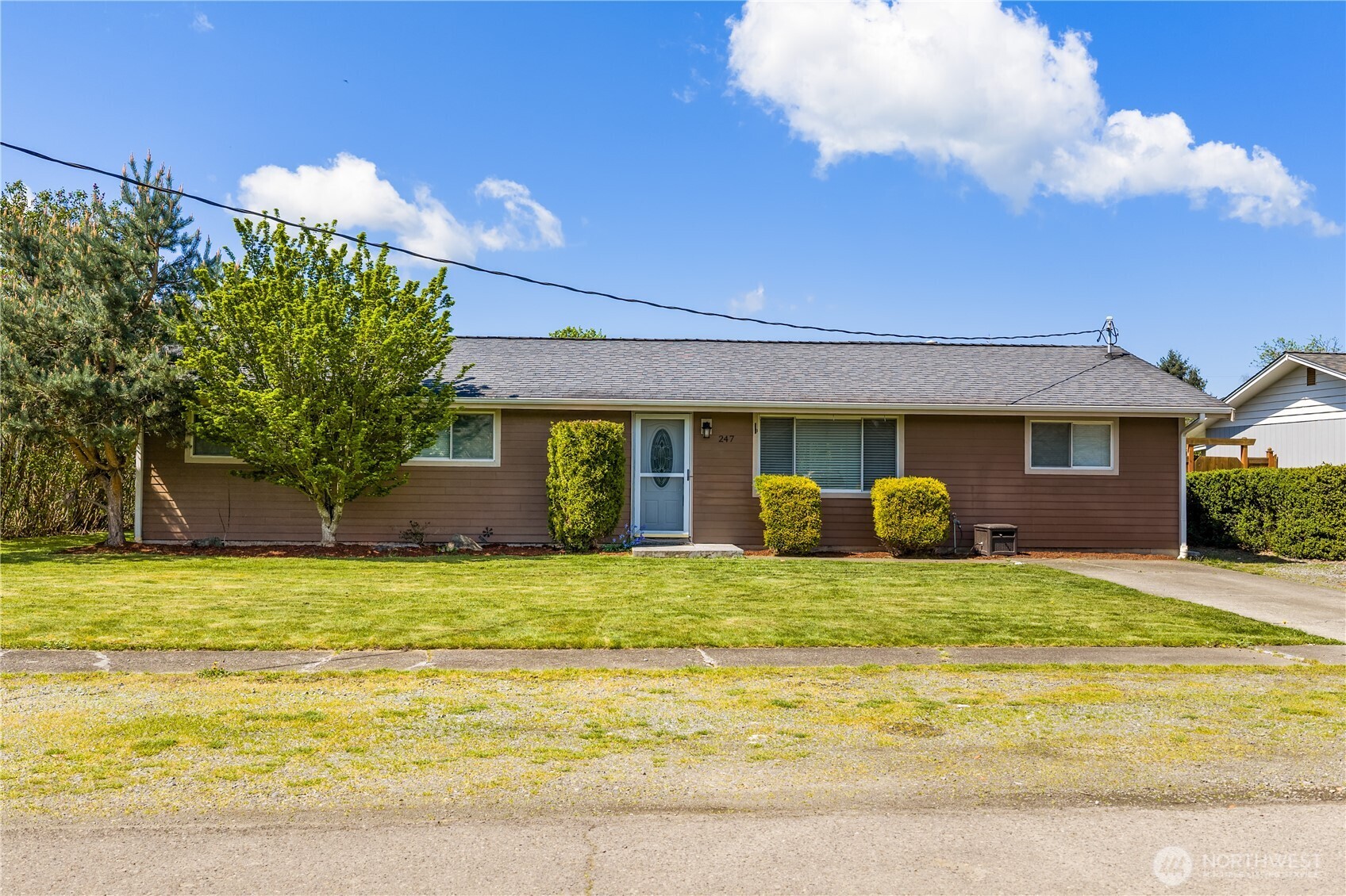 247 South D Street Buckley, WA 98321 - Photo 1 of 28 a view of a house with backyard and sitting area