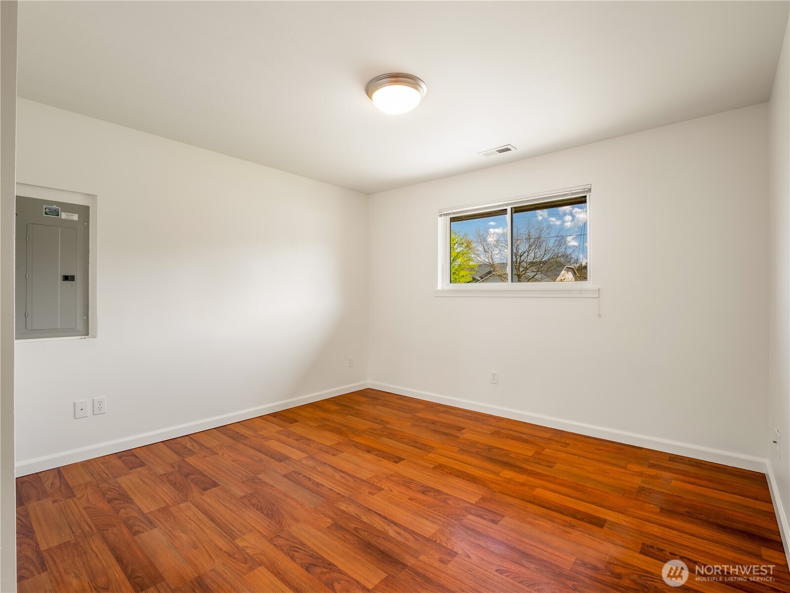 247 South D Street Buckley, WA 98321 - Photo 14 of 28 a view of empty room with wooden floor