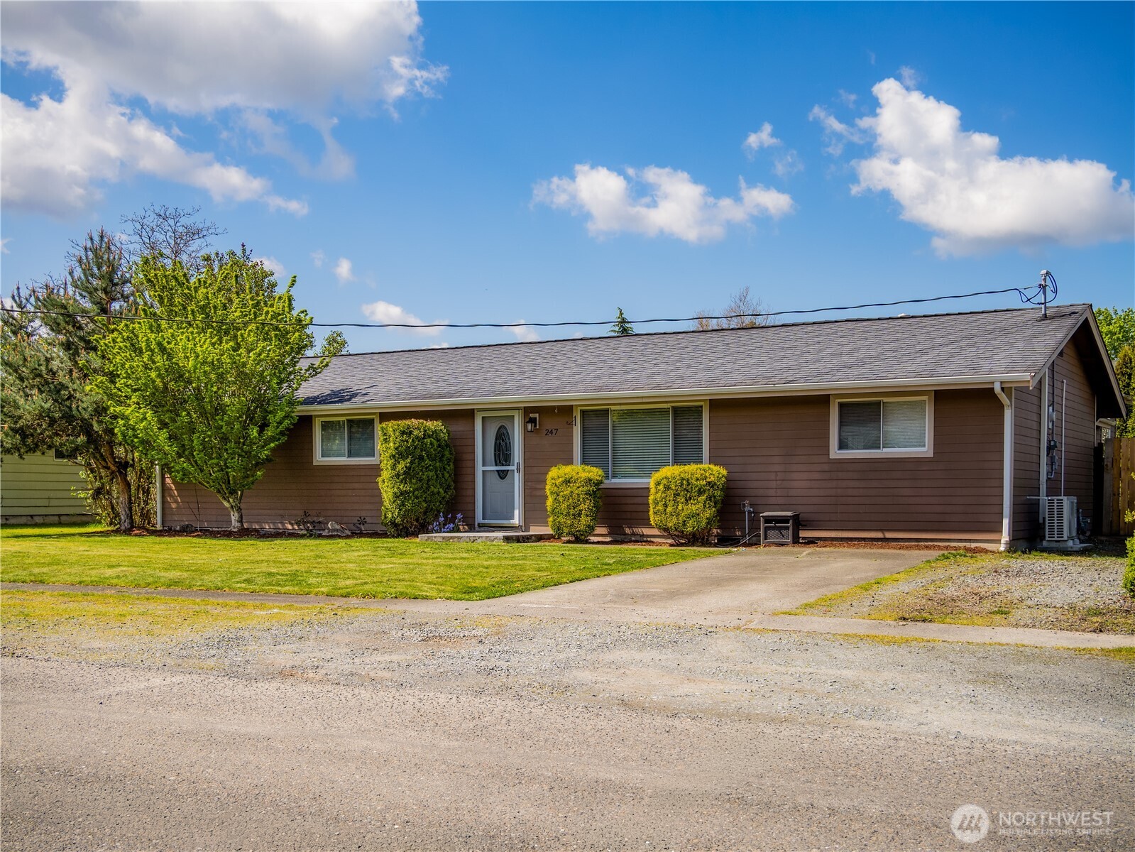 247 South D Street Buckley, WA 98321 - Photo 2 of 28 a view of a house with a patio and a yard