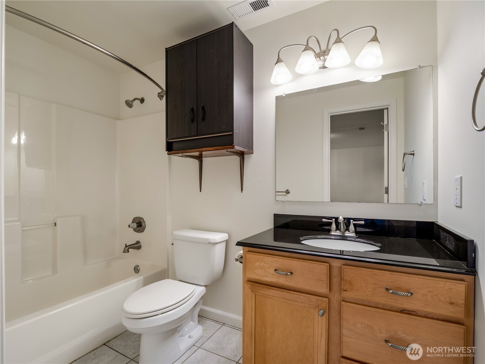 247 South D Street Buckley, WA 98321 - Photo 10 of 28 a bathroom with a toilet sink and mirror