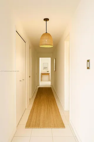 a spacious bathroom with a granite countertop sink a toilet a mirror and shower