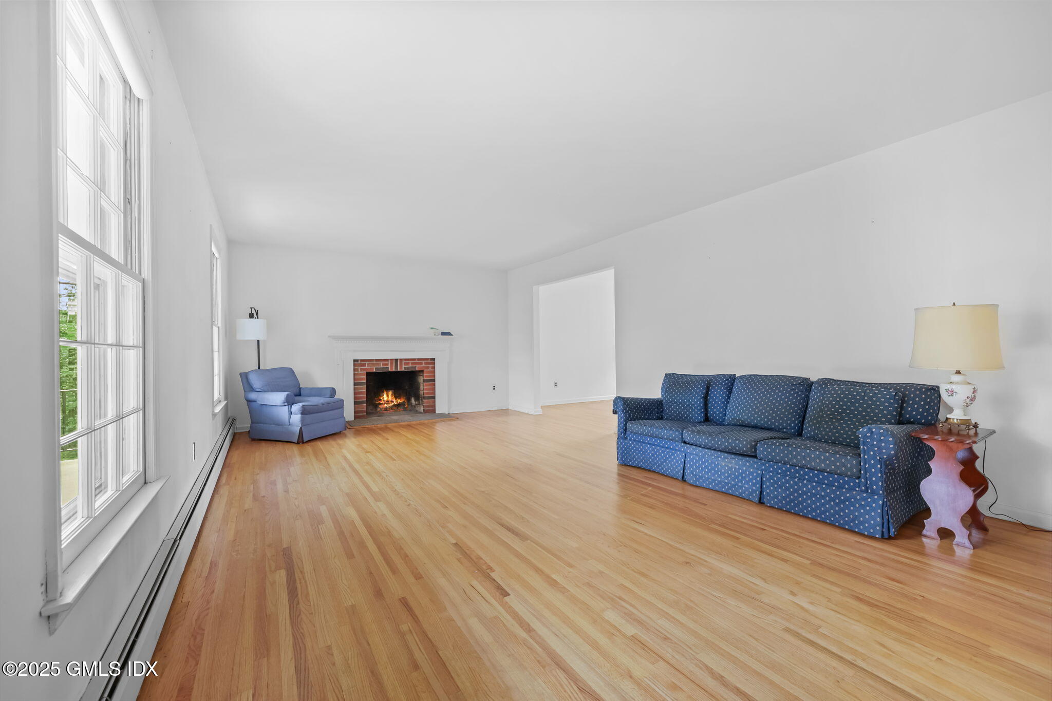 137 Shore Road Old Greenwich, CT 06870 - Photo 3 of 15 a living room with furniture and a fireplace