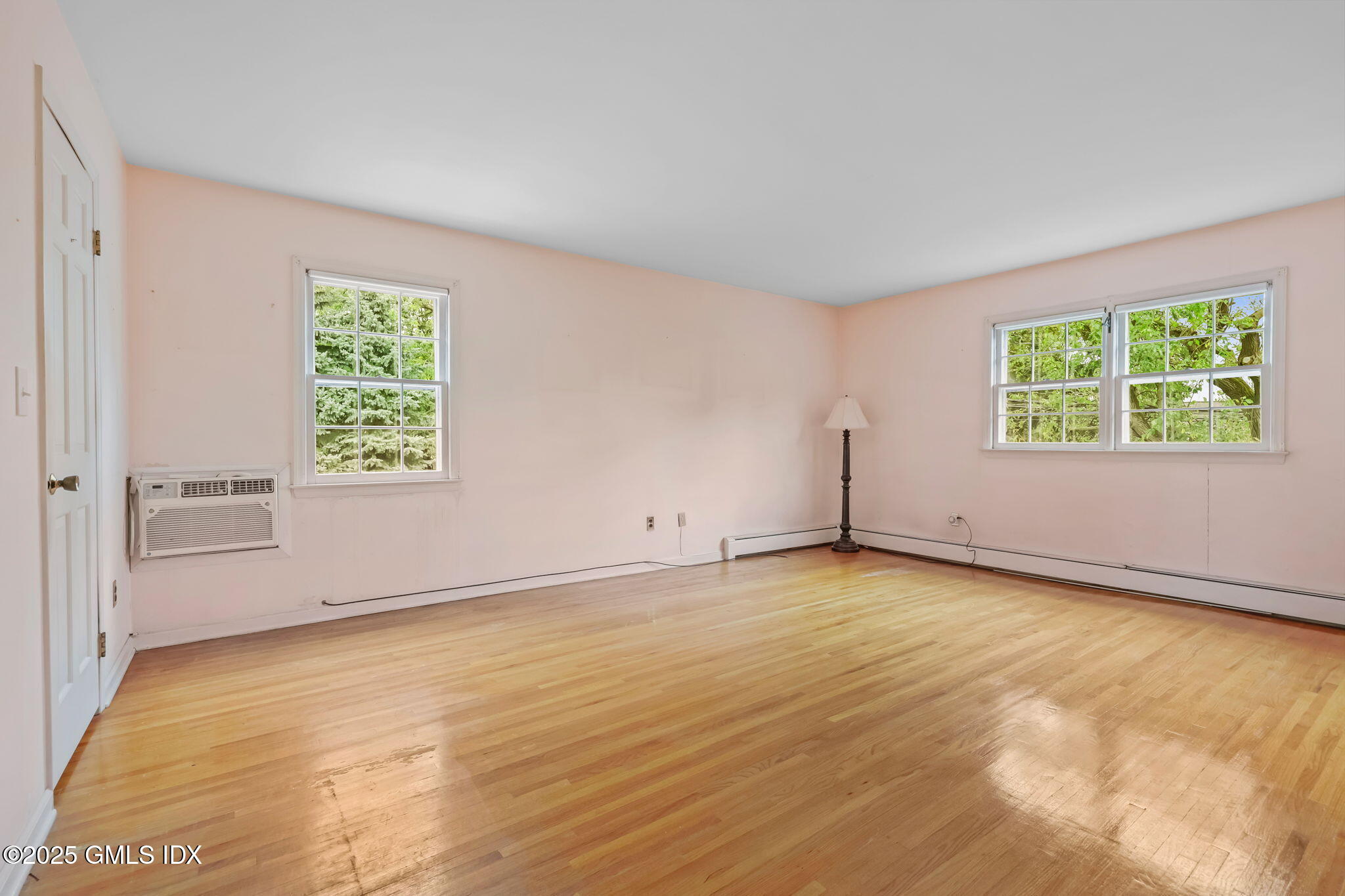 137 Shore Road Old Greenwich, CT 06870 - Photo 7 of 15 an empty room with windows