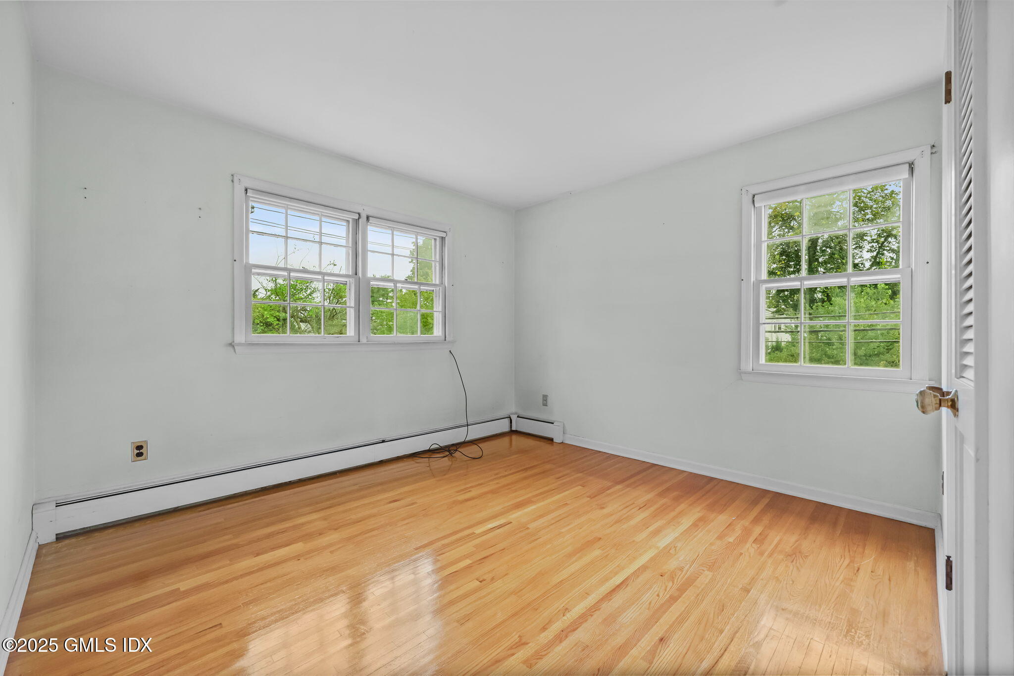 137 Shore Road Old Greenwich, CT 06870 - Photo 9 of 15 an empty room with a window