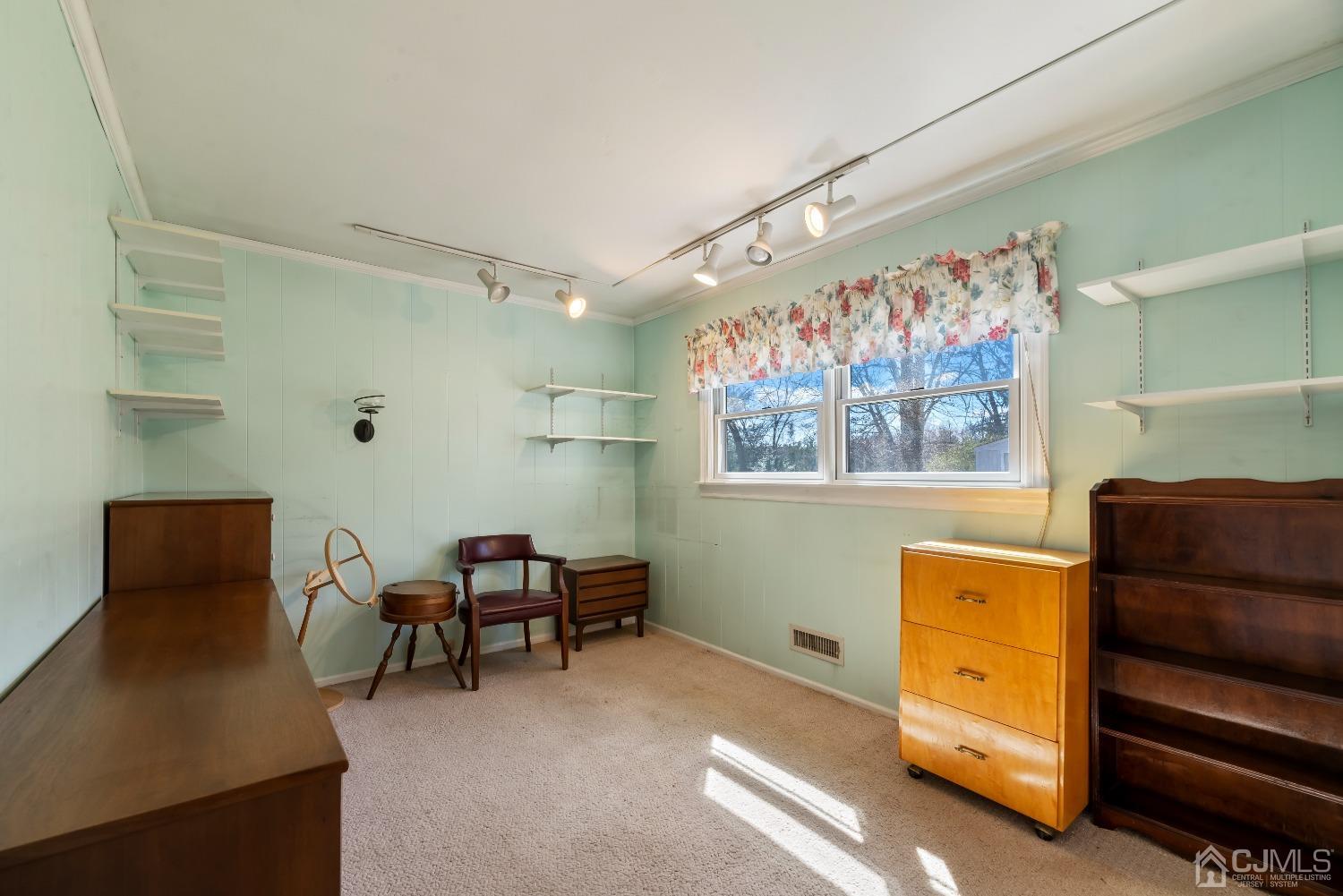 2 Perry Road East Brunswick, NJ 08816 - Photo 16 of 32 a view of a workspace with furniture and a window
