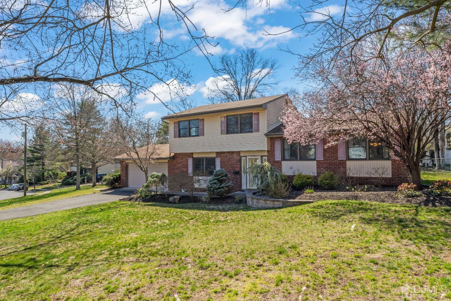 2 Perry Road East Brunswick, NJ 08816 - Photo 2 of 32 a front view of a house with garden