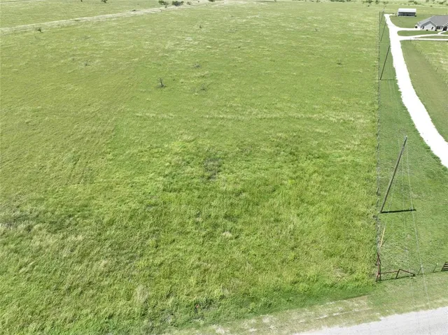 a view of a bathroom with a sink and a yard