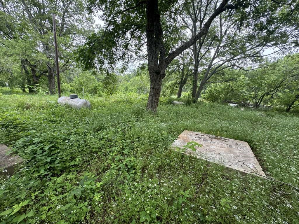 1515 Pilot Grove Road Whitewright, TX 75491 - Photo 11 of 13 a backyard of a house with trees and outdoor seating