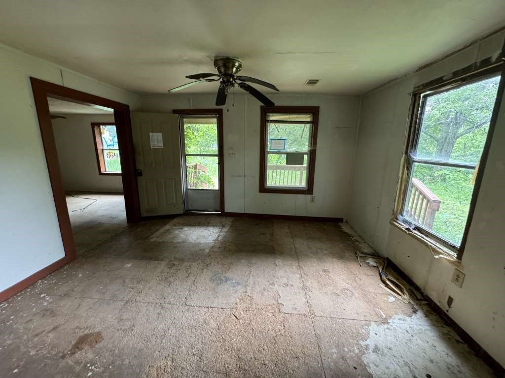 1515 Pilot Grove Road Whitewright, TX 75491 - Photo 8 of 13 a view of an empty room with a window