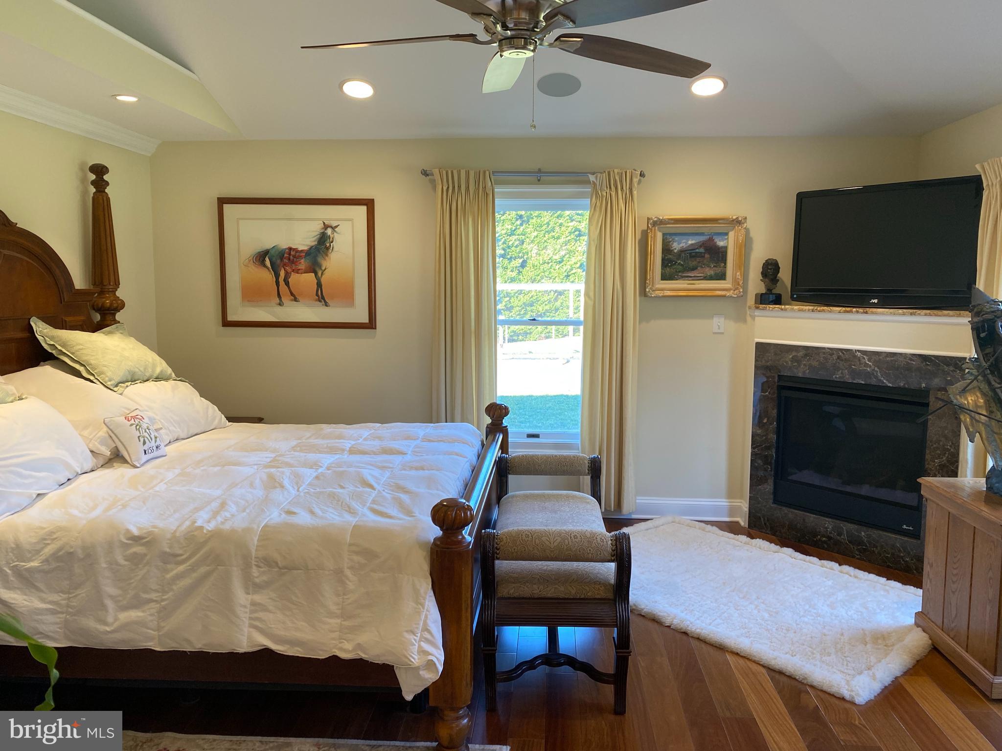 970 St George Barber Road Davidsonville, MD 21035 - Photo 17 of 69 a bedroom with a bed and a flat screen tv