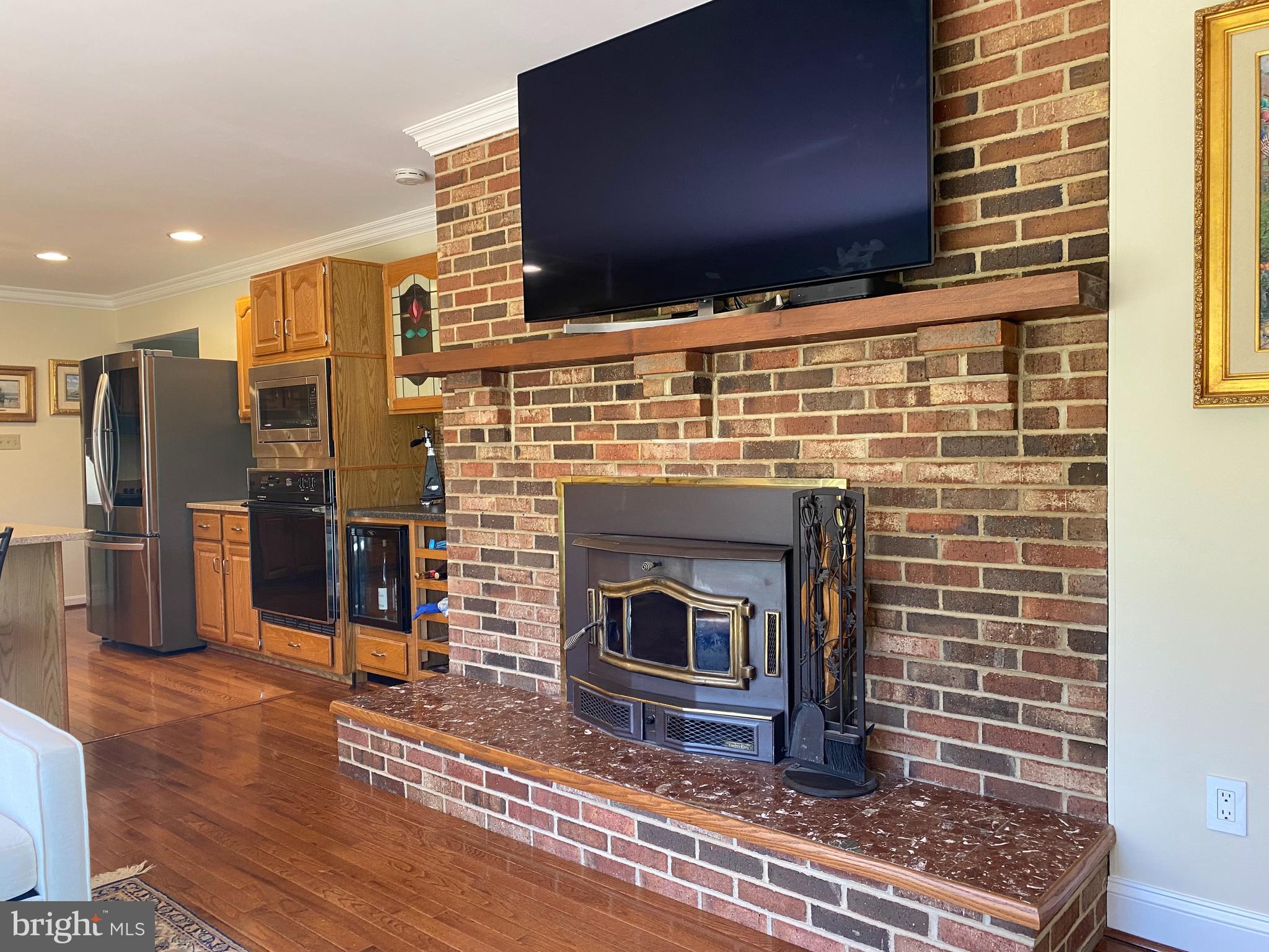 970 St George Barber Road Davidsonville, MD 21035 - Photo 31 of 69 a living room with stainless steel appliances wooden floor and a fireplace