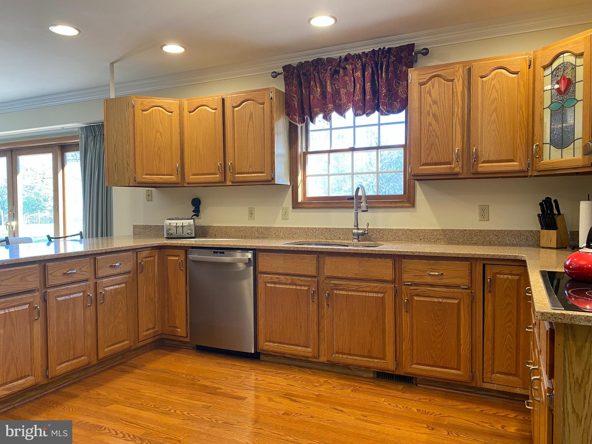 970 St George Barber Road Davidsonville, MD 21035 - Photo 33 of 69 a kitchen with stainless steel appliances granite countertop a sink a stove cabinets counter space and a window