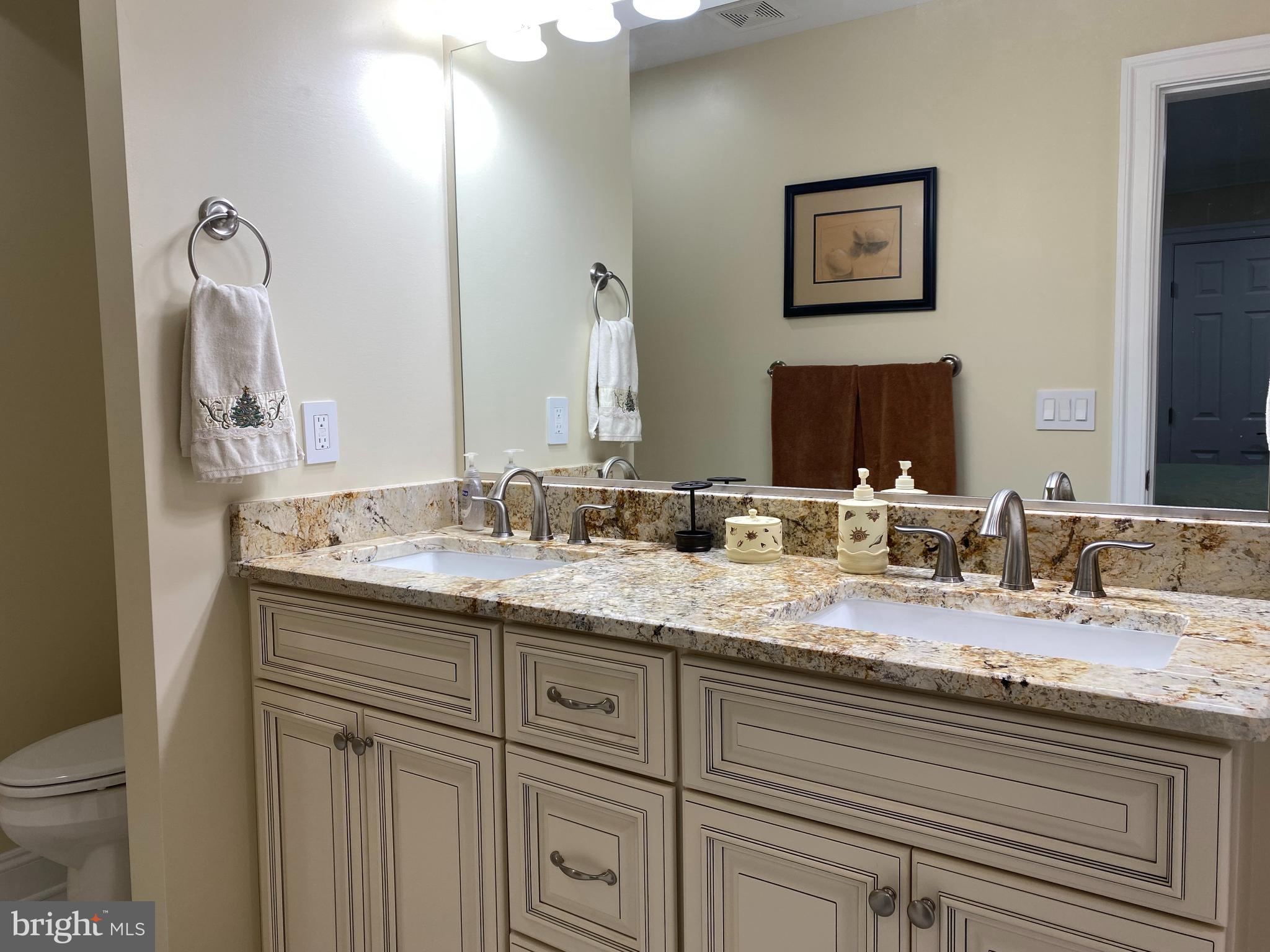 970 St George Barber Road Davidsonville, MD 21035 - Photo 46 of 69 a bathroom with a granite countertop sink mirror and toilet