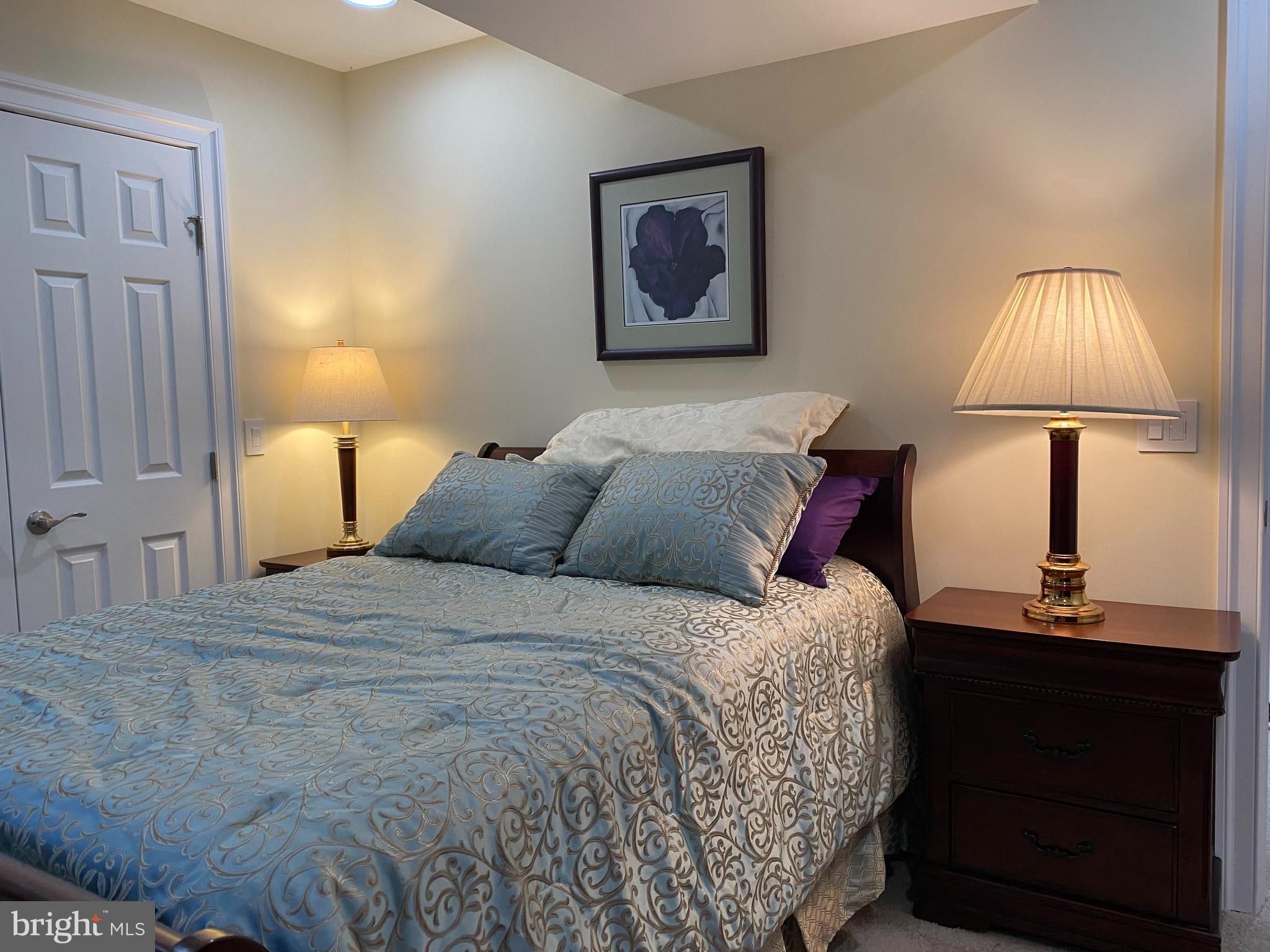 970 St George Barber Road Davidsonville, MD 21035 - Photo 49 of 69 a bedroom with a bed and a lamp