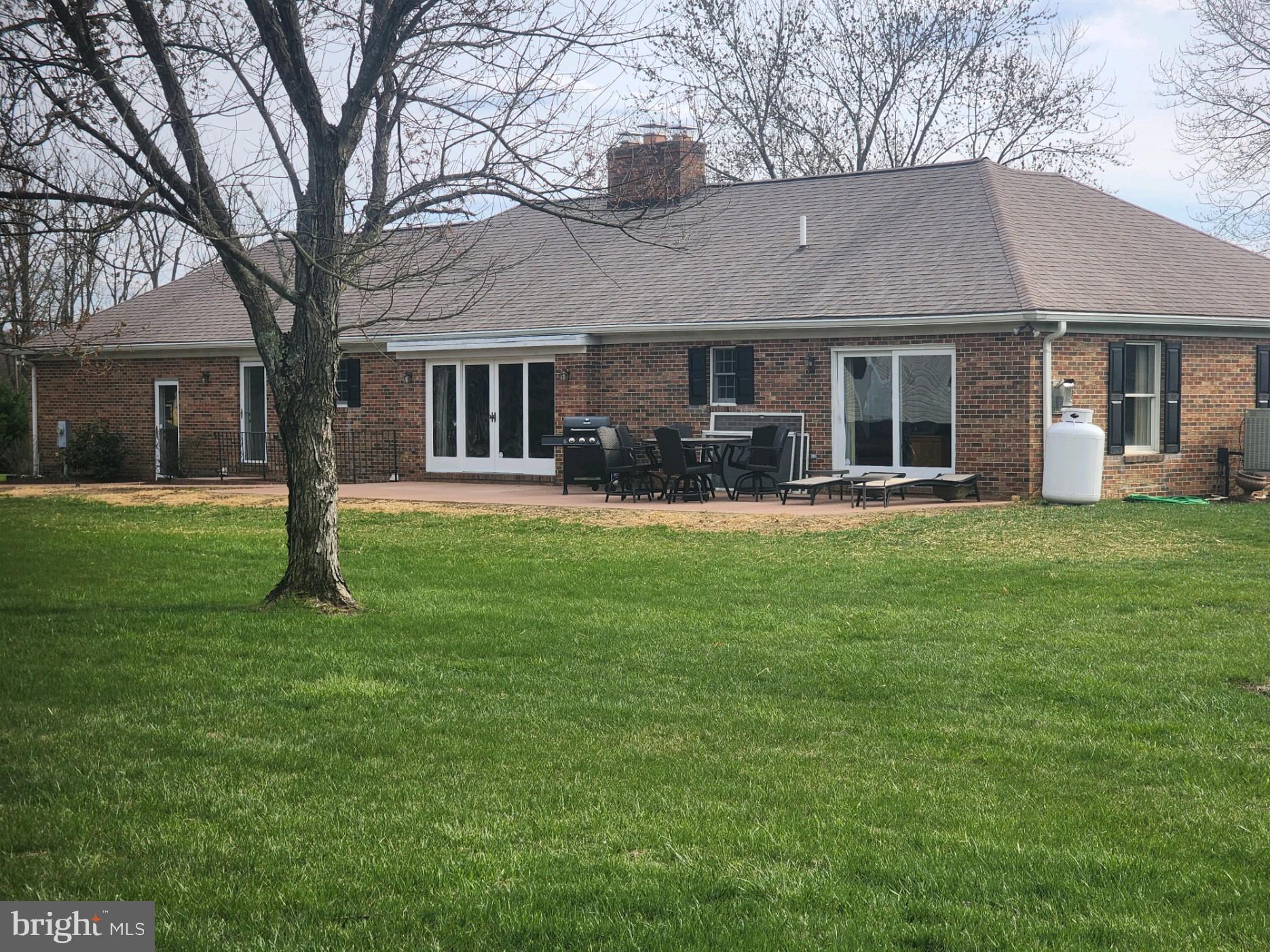 970 St George Barber Road Davidsonville, MD 21035 - Photo 6 of 69 a front view of a house with a garden and trees