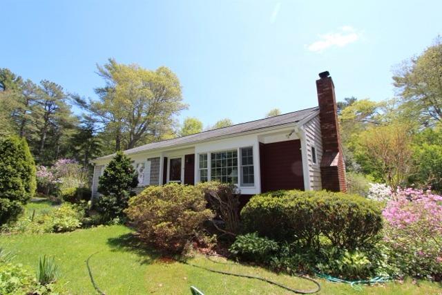 19 Taramac Road Centerville, MA 02632 - Photo 1 of 4 a front view of a house with garden